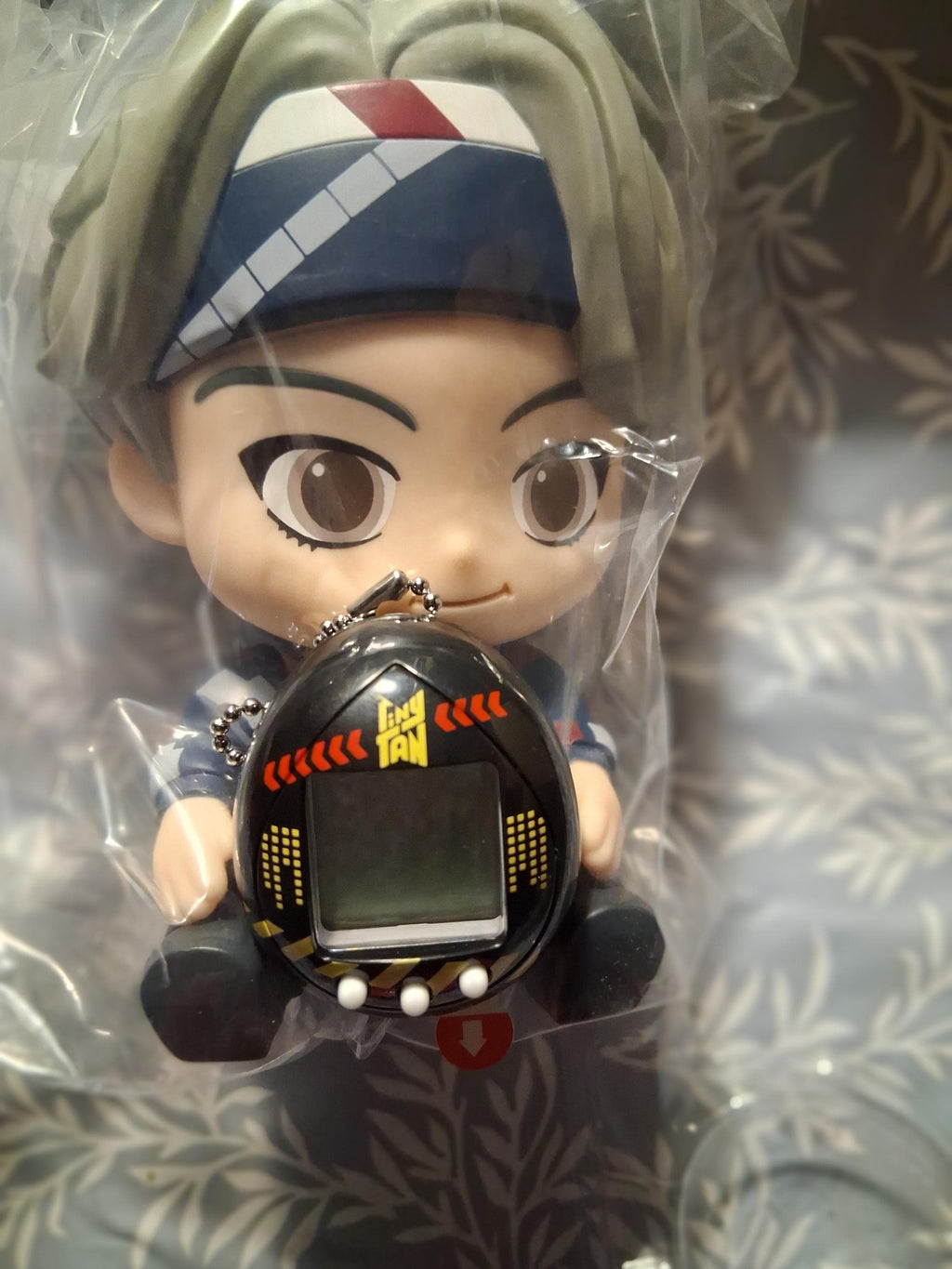 Gift basket with candy, BTS figure and mini tomagotchi